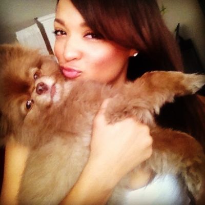Photo of Sal Stowers kissing her cute dog, Nugget. 